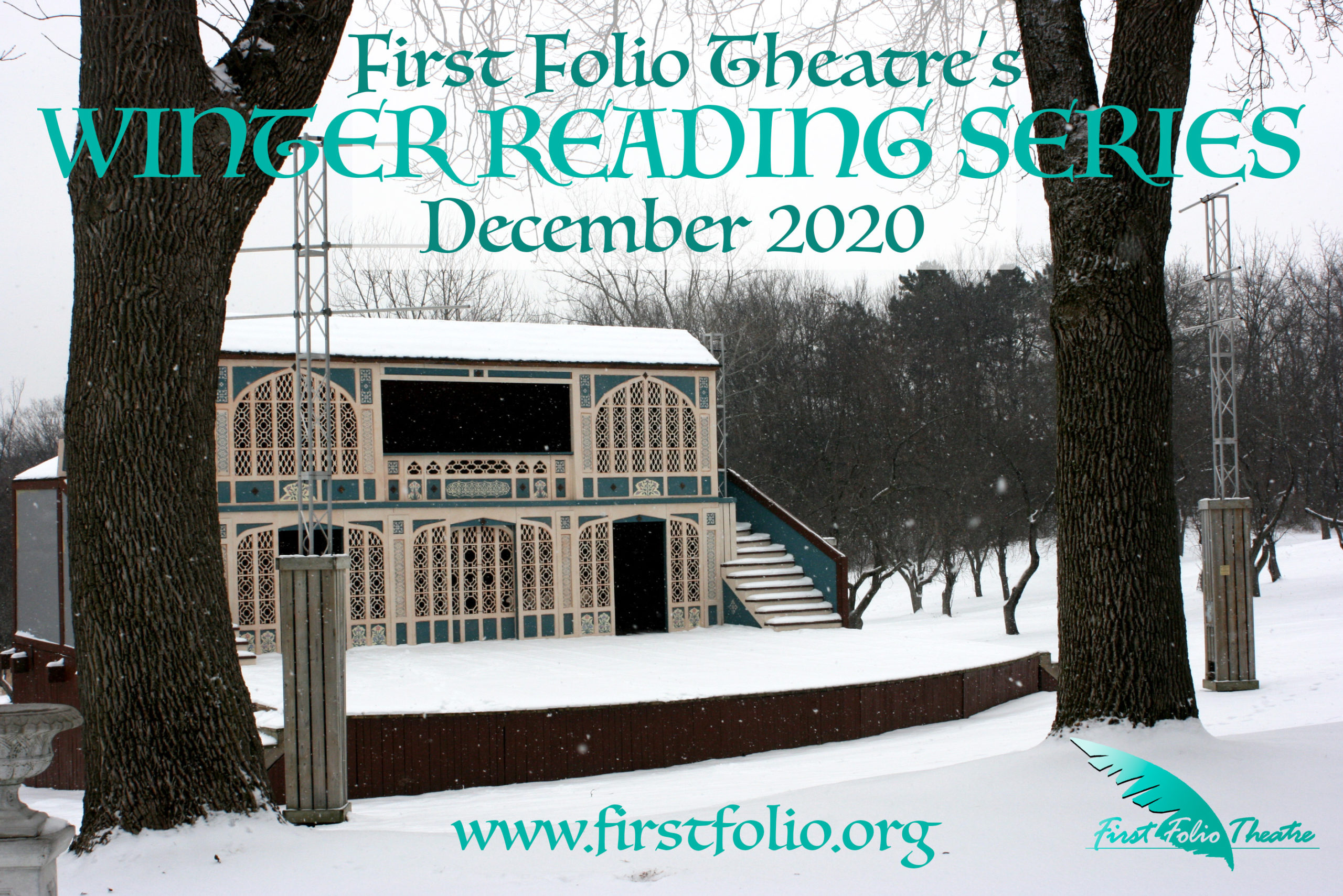 The First Folio outdoor stage in winter, covered in snow and surrounded by bare trees.
